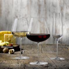 3 party red wine glasses on a table